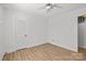 Bright bedroom with wood-look floors and ample closet space at 7016 Foxworth Dr, Charlotte, NC 28226