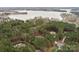 Aerial view of house near lake with wooded area at 7282 James Ct, Denver, NC 28037