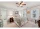 Comfortable bedroom with ceiling fan and ensuite bath access at 7282 James Ct, Denver, NC 28037