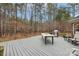 Large composite deck with table, chairs, and grill, overlooking wooded area at 7282 James Ct, Denver, NC 28037