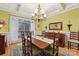 Formal dining room with chandelier and hardwood floors at 7282 James Ct, Denver, NC 28037