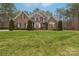 Brick two-story house with a lush green lawn at 7282 James Ct, Denver, NC 28037