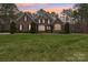 Brick house with two-car garage and manicured lawn at 7282 James Ct, Denver, NC 28037