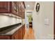 Elegant hallway with built-in cabinetry and hardwood floors at 7282 James Ct, Denver, NC 28037