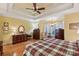 Spacious main bedroom with tray ceiling, hardwood floors, and ample natural light at 7282 James Ct, Denver, NC 28037