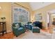 Sitting area with two armchairs and ottoman at 7282 James Ct, Denver, NC 28037