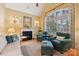 Sitting room with fireplace and large windows at 7282 James Ct, Denver, NC 28037