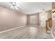 Living room with hardwood floors, a ceiling fan, and access to the front door at 729 Torrey Pines Ln, Fort Mill, SC 29715