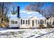 Cute bungalow with snow-covered roof and lawn at 751 N Miller Ave, Statesville, NC 28677