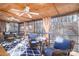 Relaxing screened porch with ceiling fan and wooded views at 9065 Burroughs Ct, Sherrills Ford, NC 28673