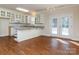 White kitchen with granite countertops and glass-front cabinets at 9107 Dogwood Ridge Dr, Charlotte, NC 28227