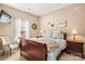 Cozy bedroom with a soft chair and a comfortable bed with a decorative throw and pillows at 9415 Rosalyn Glen Rd, Cornelius, NC 28031