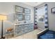 Charming bedroom with a modern gray dresser, window, and framed maps at 9415 Rosalyn Glen Rd, Cornelius, NC 28031