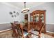 Formal dining room boasts a large wooden table, china cabinet, and chandelier lighting at 9415 Rosalyn Glen Rd, Cornelius, NC 28031