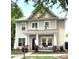 Inviting two-story home with a cozy front porch, complemented by mature landscaping and a serene neighborhood setting at 9415 Rosalyn Glen Rd, Cornelius, NC 28031