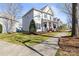 Beautiful home featuring well-maintained landscaping and classic architectural details on a sunny day at 9415 Rosalyn Glen Rd, Cornelius, NC 28031