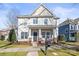 Charming two-story home with a welcoming front porch and well-manicured lawn at 9415 Rosalyn Glen Rd, Cornelius, NC 28031