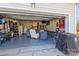 Finished garage with epoxy floors, furniture, and storage creates a functional extension of the home at 9415 Rosalyn Glen Rd, Cornelius, NC 28031