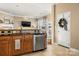 Spacious kitchen with wood cabinetry, granite counters, stainless steel appliances and eat-in area at 9415 Rosalyn Glen Rd, Cornelius, NC 28031