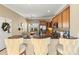 Stylish kitchen featuring a breakfast bar, stainless steel appliances, and elegant wooden cabinetry at 9415 Rosalyn Glen Rd, Cornelius, NC 28031