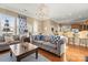 Inviting living room with neutral tones, hardwood floors, and views into the adjacent kitchen area at 9415 Rosalyn Glen Rd, Cornelius, NC 28031