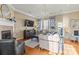 Bright living room with a fireplace, hardwood floors, and stylish decor and modern furniture at 9415 Rosalyn Glen Rd, Cornelius, NC 28031