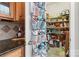 Walk-in pantry featuring wood shelving, a door organizer, and lots of storage space at 9415 Rosalyn Glen Rd, Cornelius, NC 28031