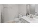 Clean bathroom with toilet, vanity, and shower bathtub at 10225 Black Locust Ln, Charlotte, NC 28215