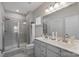 Elegant bathroom with double vanity and walk-in shower at 10225 Black Locust Ln, Charlotte, NC 28215