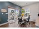 Kitchen dining area with white round table and four black chairs, and sliding glass doors at 10225 Black Locust Ln, Charlotte, NC 28215