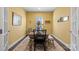 Charming dining room with wood table and yellow walls at 10225 Black Locust Ln, Charlotte, NC 28215