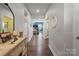 Bright and spacious entryway with hardwood floors and a view to the living room at 10225 Black Locust Ln, Charlotte, NC 28215