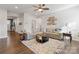 Living room with gray sectional sofa, coffee table, and hardwood floors at 10225 Black Locust Ln, Charlotte, NC 28215