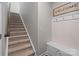 Staircase with built-in bench and storage at 10225 Black Locust Ln, Charlotte, NC 28215