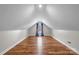 Bonus room featuring hardwood floors and a window with curtains at 104 Brookview Dr, Shelby, NC 28152