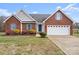 Brick ranch house with attached garage and manicured lawn at 104 Brookview Dr, Shelby, NC 28152