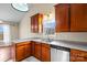 View of kitchen sink, dishwasher, and wood cabinets at 104 Brookview Dr, Shelby, NC 28152