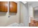 Laundry room with wood cabinets and access to stairs at 104 Brookview Dr, Shelby, NC 28152