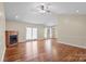 Hardwood floor living room with corner fireplace and high ceilings at 104 Brookview Dr, Shelby, NC 28152