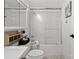 Bathroom with shower/tub combo, updated vanity, and pebble floor at 1115 Scaleybark Rd # D, Charlotte, NC 28209