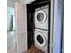 Stackable washer and dryer in a well-lit laundry closet at 1115 Scaleybark Rd # D, Charlotte, NC 28209