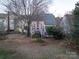 Backyard with patio, deck, and mature trees at 117 Biscayne Ct, Mooresville, NC 28117