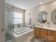 Bathroom with double vanity, soaking tub and separate shower at 117 Biscayne Ct, Mooresville, NC 28117