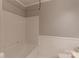 Clean bathroom with a shower and tub combination and white paneling at 117 Biscayne Ct, Mooresville, NC 28117