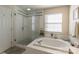 Bathroom with a large walk-in shower and soaking tub at 117 Biscayne Ct, Mooresville, NC 28117