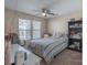 Bedroom with a double bed, window, ceiling fan, and bookshelf at 117 Biscayne Ct, Mooresville, NC 28117