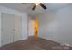 Bedroom with neutral carpet and a closet with an open doorway at 117 Biscayne Ct, Mooresville, NC 28117