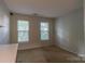 Bedroom featuring neutral walls, carpet, and well-lit windows at 117 Biscayne Ct, Mooresville, NC 28117