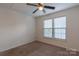 Bedroom with neutral carpet, ceiling fan, and a window with blinds at 117 Biscayne Ct, Mooresville, NC 28117