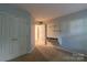 Bright bedroom featuring a built-in desk, closet, and neutral carpet at 117 Biscayne Ct, Mooresville, NC 28117